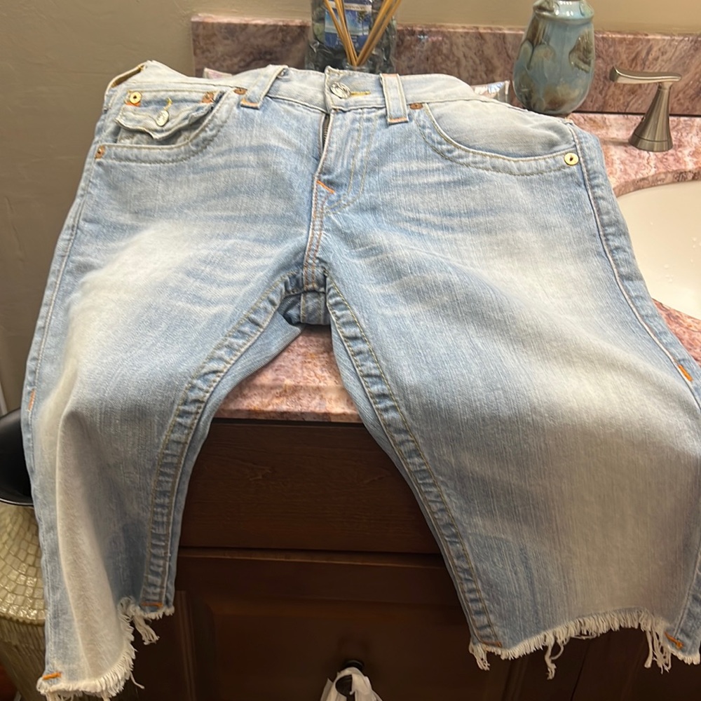 Light blue true religion jeans short knee length with frill at bottom of short